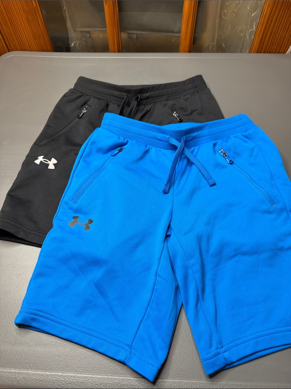Kid’s Under Armour Shorts — Blue & Black. Size: Medium